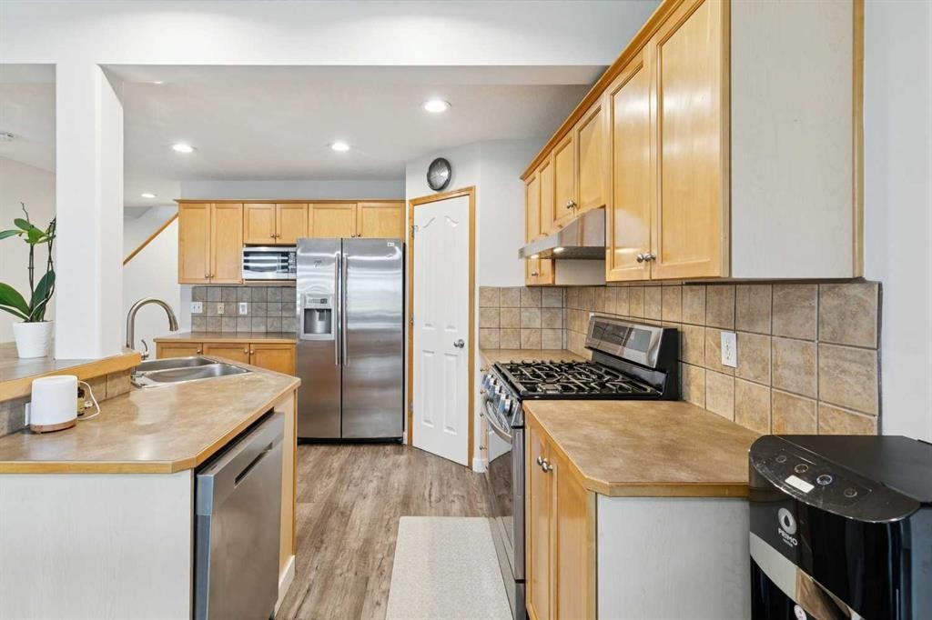 126 Somerglen Way Sw, Calgary, AB - Indoor Photo Showing Kitchen With Stainless Steel Kitchen With Double Sink