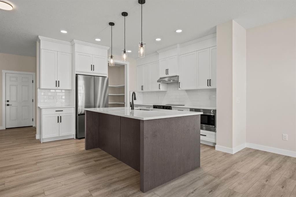 435 Kinniburgh Loop, Chestermere, AB - Indoor Photo Showing Kitchen With Stainless Steel Kitchen With Upgraded Kitchen