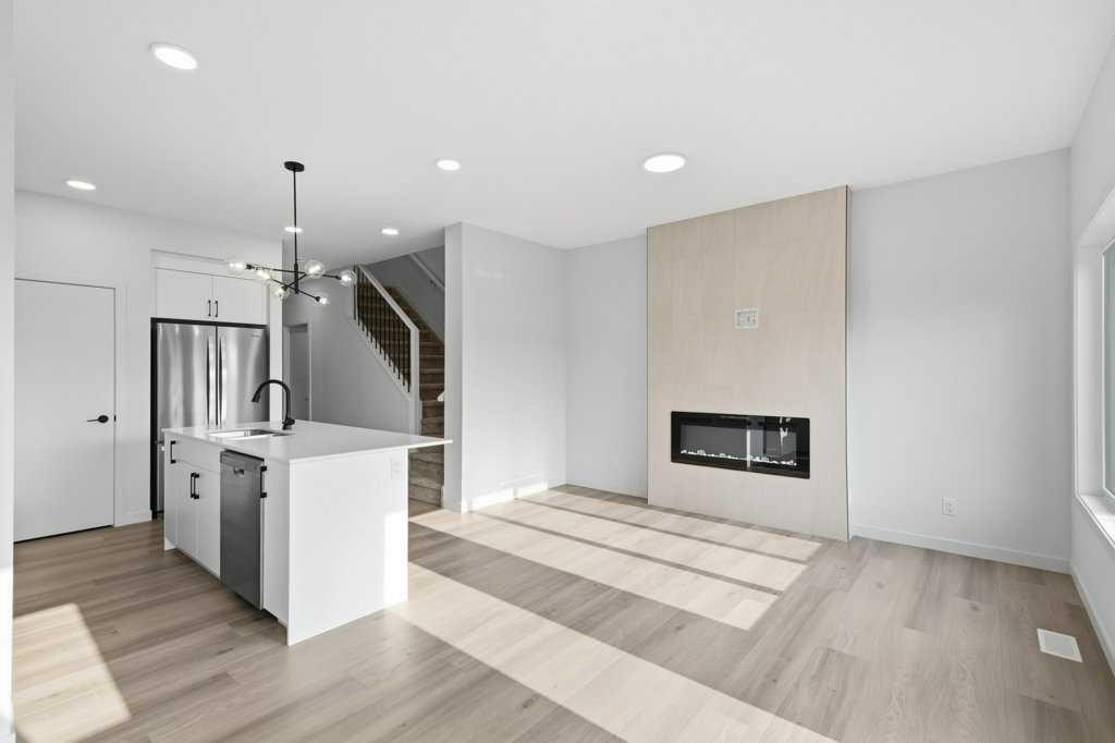 30 Heritage Heath, Cochrane, AB - Indoor With Fireplace