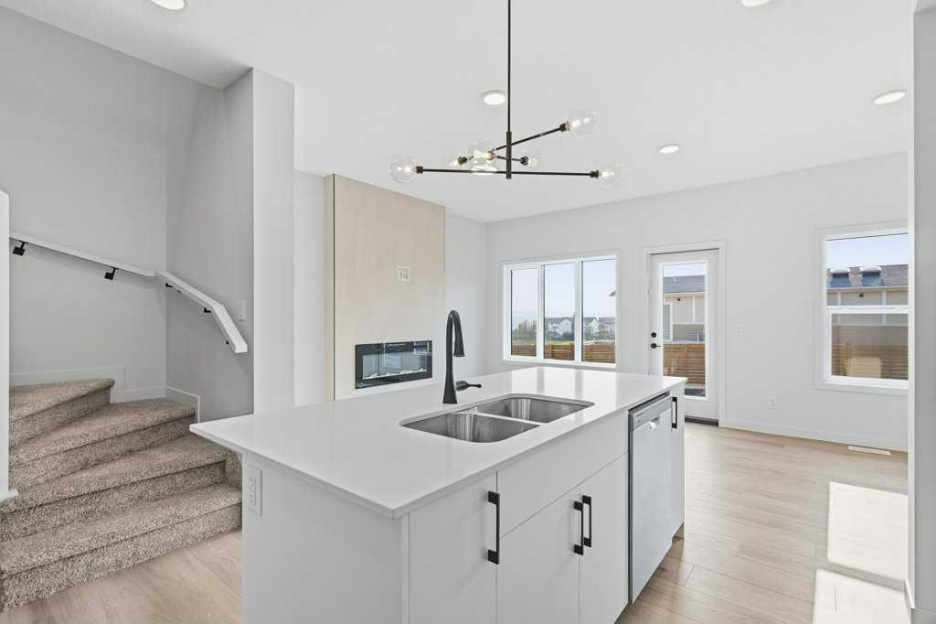 30 Heritage Heath, Cochrane, AB - Indoor Photo Showing Kitchen With Double Sink