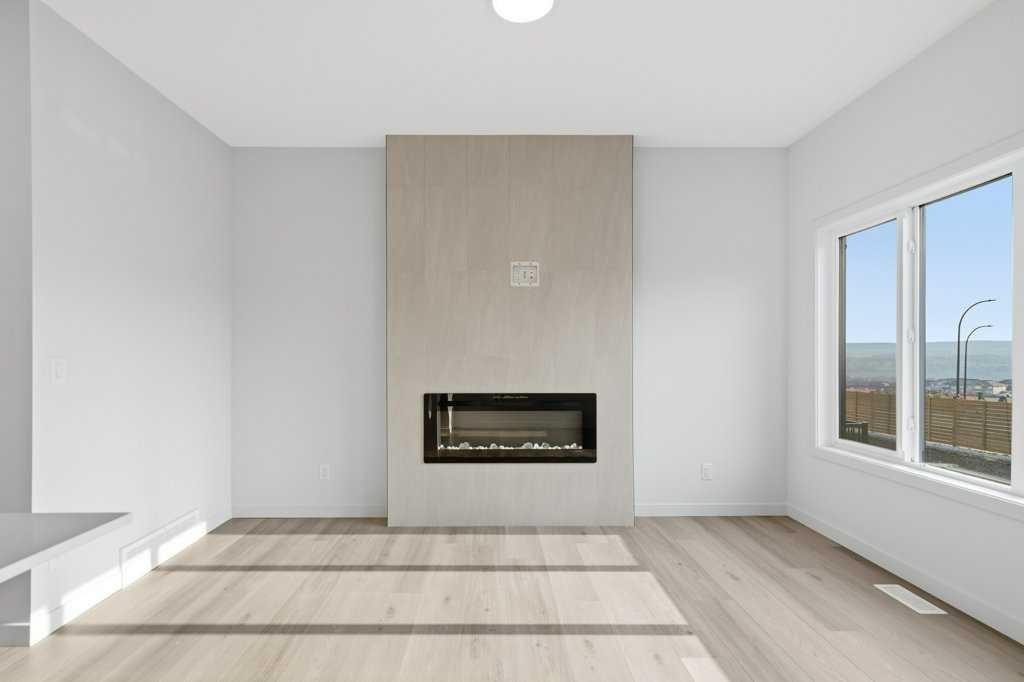 30 Heritage Heath, Cochrane, AB - Indoor Photo Showing Living Room With Fireplace