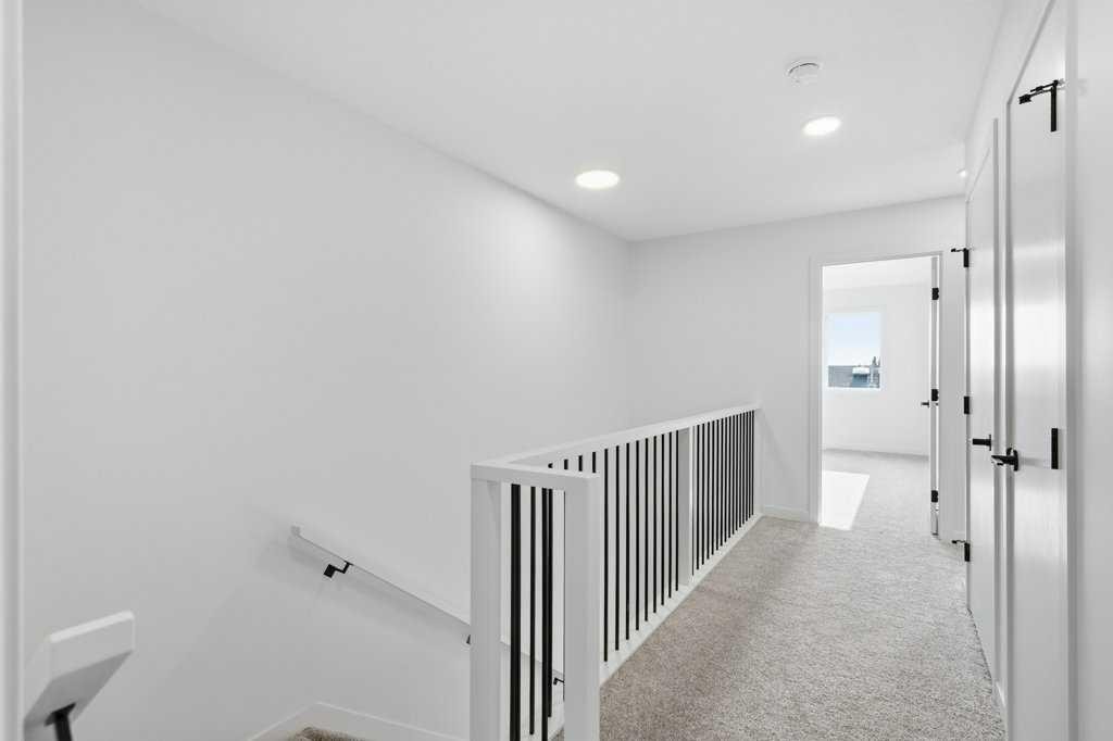 30 Heritage Heath, Cochrane, AB - Indoor Photo Showing Other Room