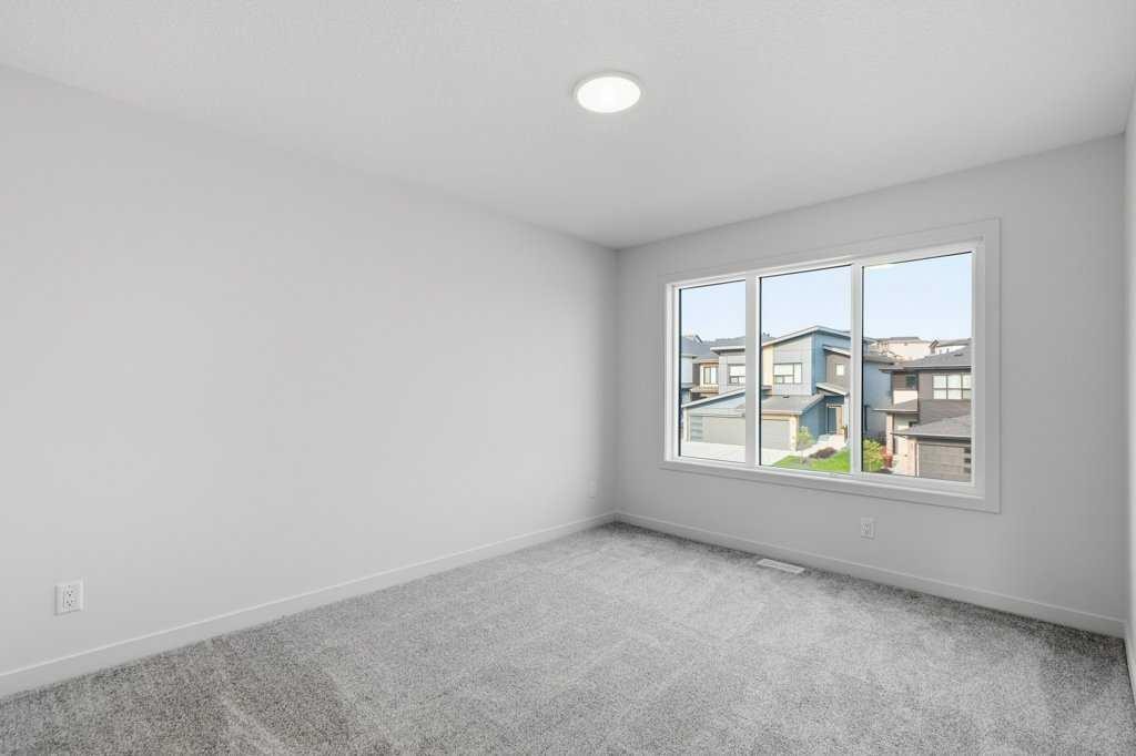 30 Heritage Heath, Cochrane, AB - Indoor Photo Showing Other Room