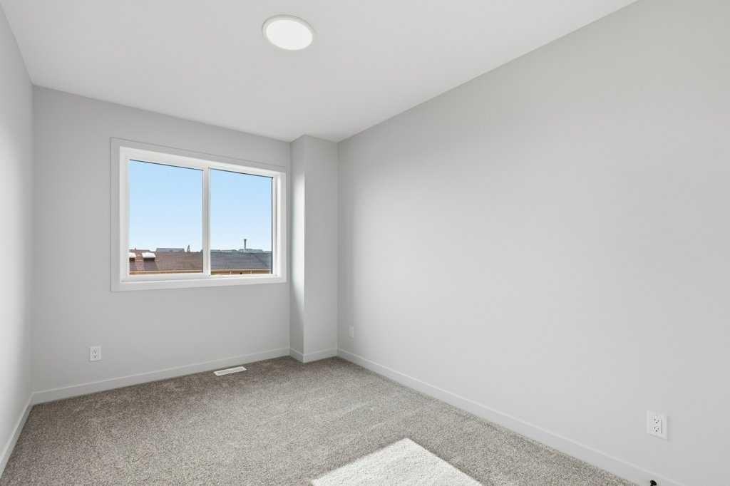 30 Heritage Heath, Cochrane, AB - Indoor Photo Showing Other Room