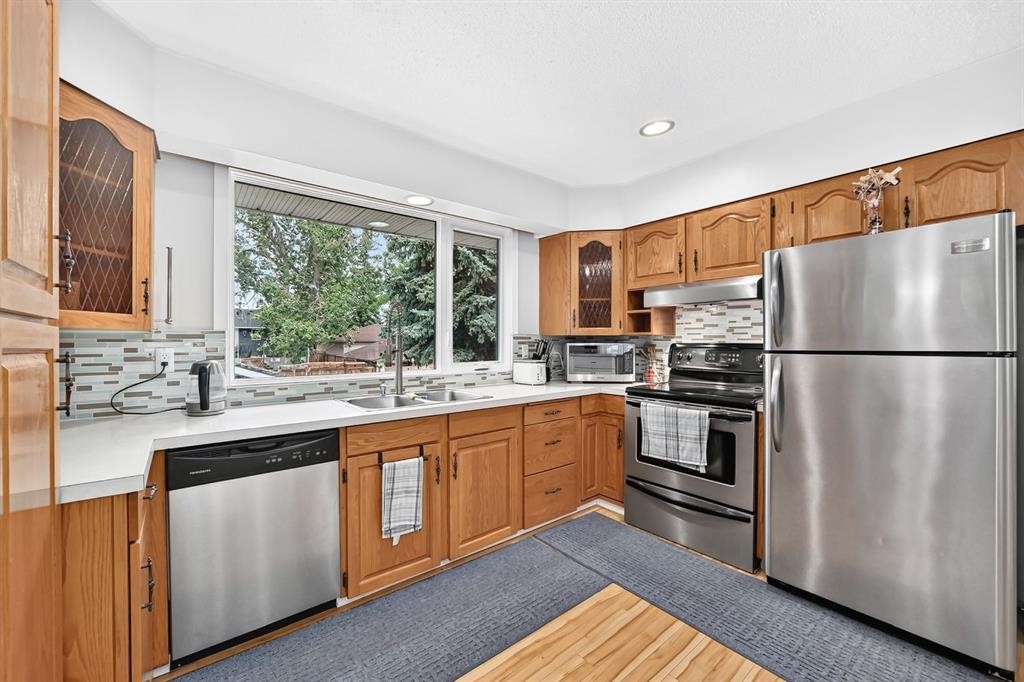1008 Cantabrian Drive Sw, Calgary, AB - Indoor Photo Showing Kitchen With Stainless Steel Kitchen With Double Sink