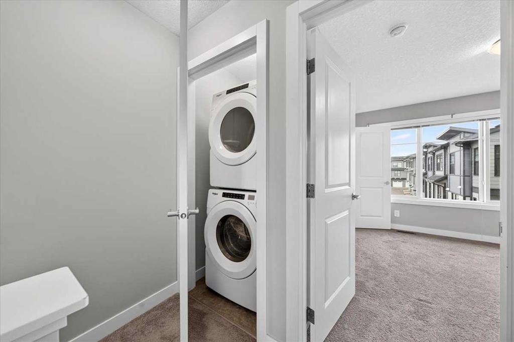 154 Seton Passage Se, Calgary, AB - Indoor Photo Showing Laundry Room