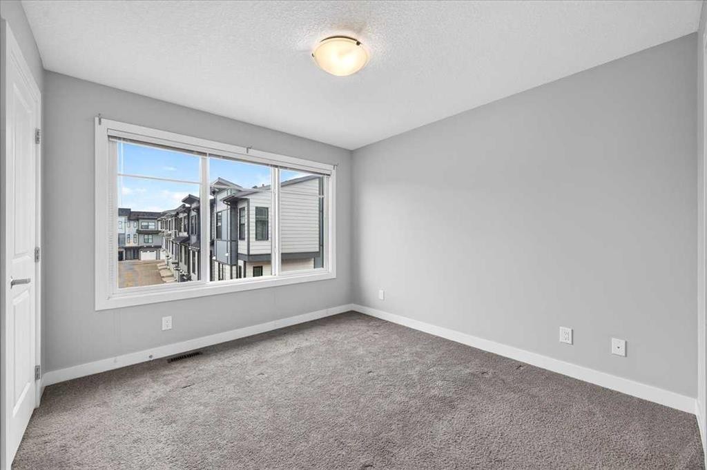 154 Seton Passage Se, Calgary, AB - Indoor Photo Showing Other Room