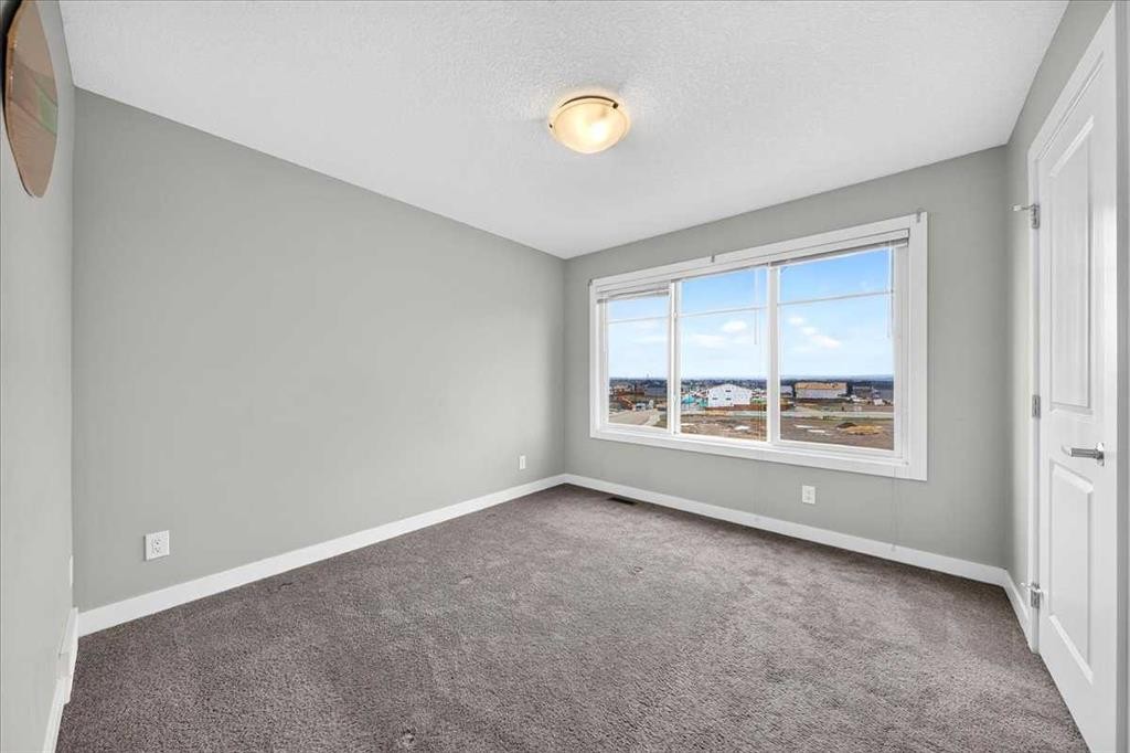 154 Seton Passage Se, Calgary, AB - Indoor Photo Showing Other Room
