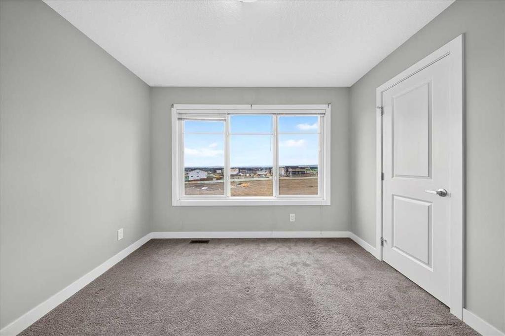 154 Seton Passage Se, Calgary, AB - Indoor Photo Showing Other Room
