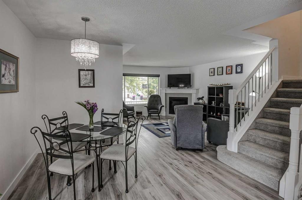 58 Sierra Morena Gardens Sw, Calgary, AB - Indoor Photo Showing Dining Room With Fireplace