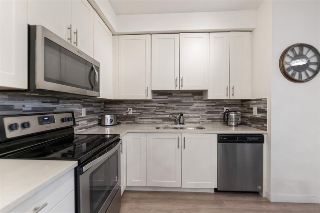 3108-99 Copperstone Park Se, Calgary, AB - Indoor Photo Showing Kitchen With Stainless Steel Kitchen With Double Sink