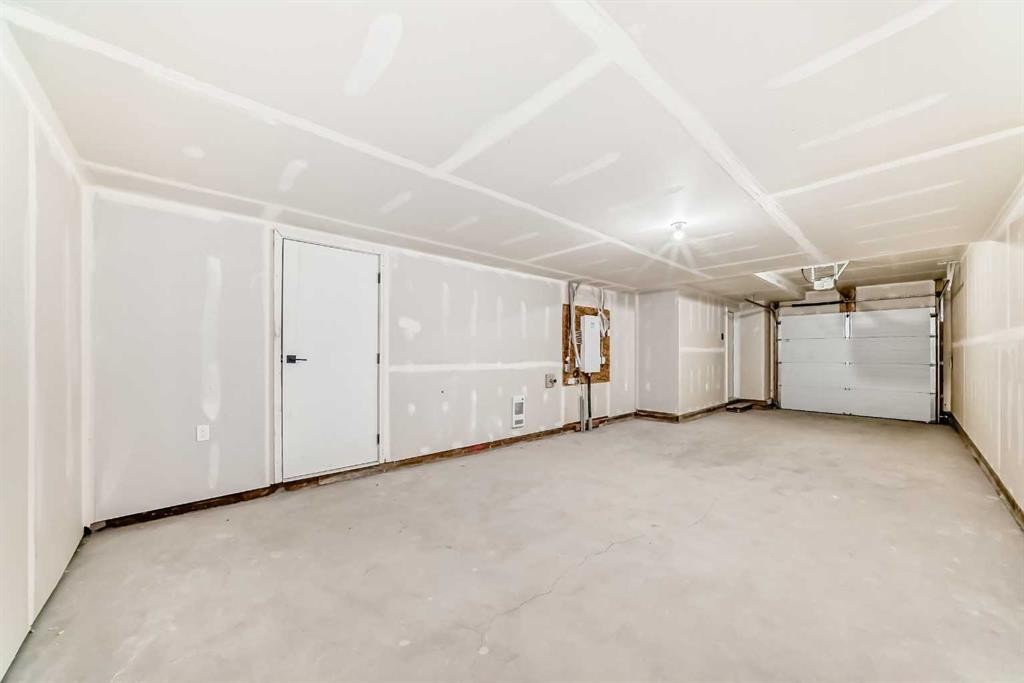 103 Osprey Hill Point Sw, Calgary, AB - Indoor Photo Showing Garage