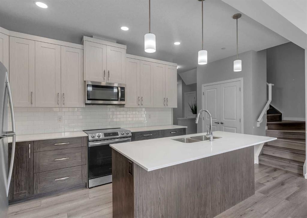 217 Lucas Crescent Nw, Calgary, AB - Indoor Photo Showing Kitchen With Stainless Steel Kitchen With Double Sink With Upgraded Kitchen
