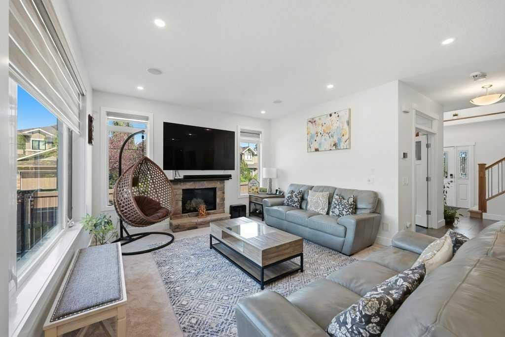 160 Panatella Crescent Nw, Calgary, AB - Indoor Photo Showing Living Room With Fireplace