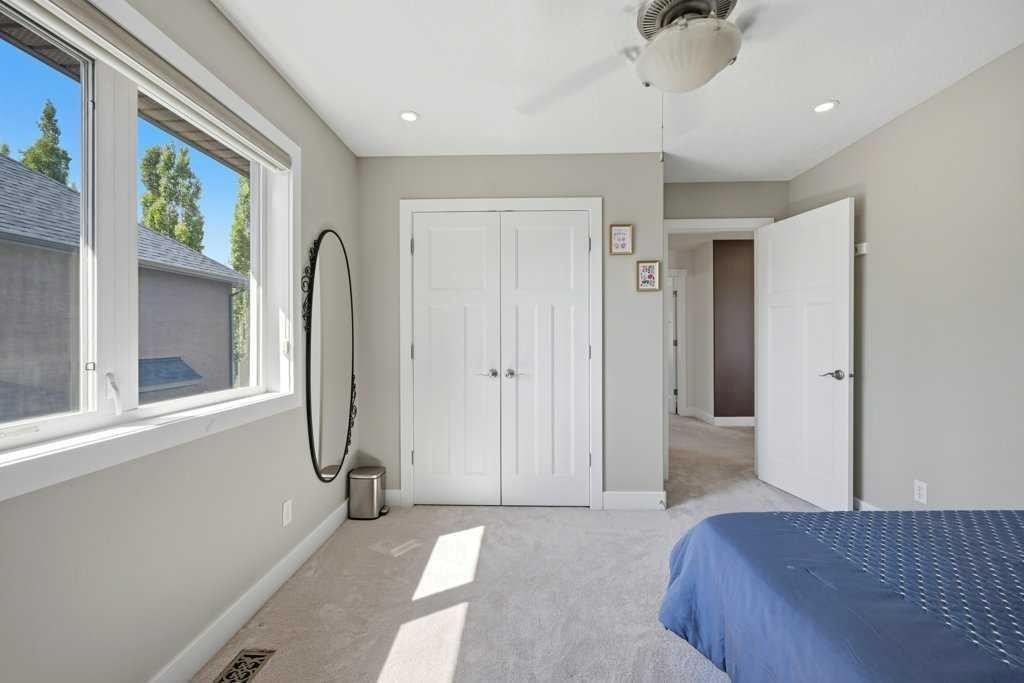 160 Panatella Crescent Nw, Calgary, AB - Indoor Photo Showing Bedroom