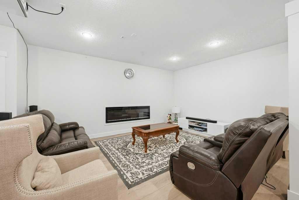 160 Panatella Crescent Nw, Calgary, AB - Indoor Photo Showing Other Room With Fireplace