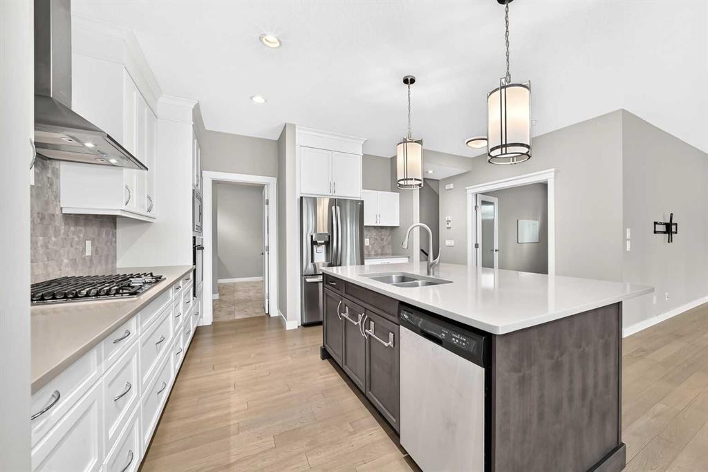 143 Stonemere Green, Chestermere, AB - Indoor Photo Showing Kitchen With Stainless Steel Kitchen With Double Sink With Upgraded Kitchen