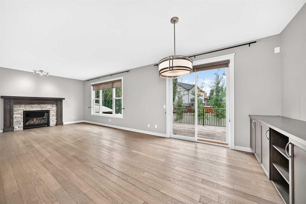 143 Stonemere Green, Chestermere, AB - Indoor Photo Showing Living Room With Fireplace