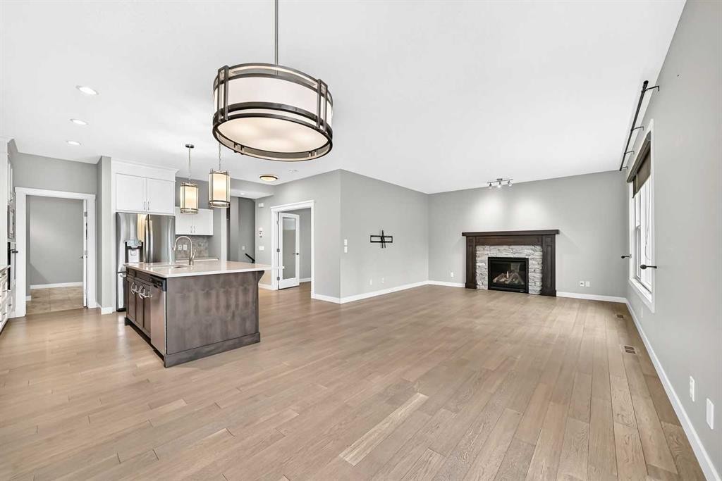 143 Stonemere Green, Chestermere, AB - Indoor With Fireplace