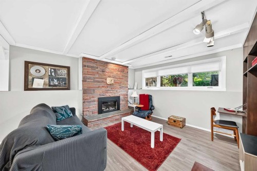 9120 48 Avenue Nw, Calgary, AB - Indoor Photo Showing Living Room With Fireplace