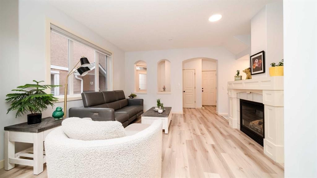 93 Cranleigh Heath Se, Calgary, AB - Indoor Photo Showing Living Room With Fireplace
