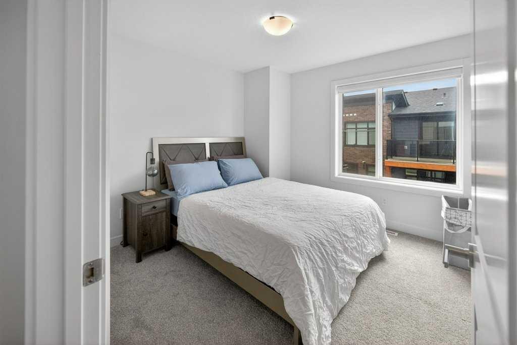 606-550 Seton Circle Se, Calgary, AB - Indoor Photo Showing Bedroom