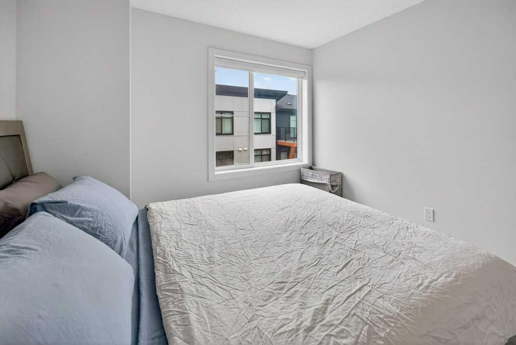 606-550 Seton Circle Se, Calgary, AB - Indoor Photo Showing Bedroom