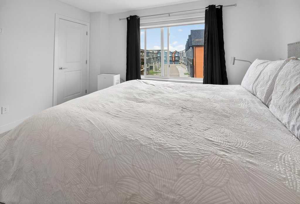 606-550 Seton Circle Se, Calgary, AB - Indoor Photo Showing Bedroom