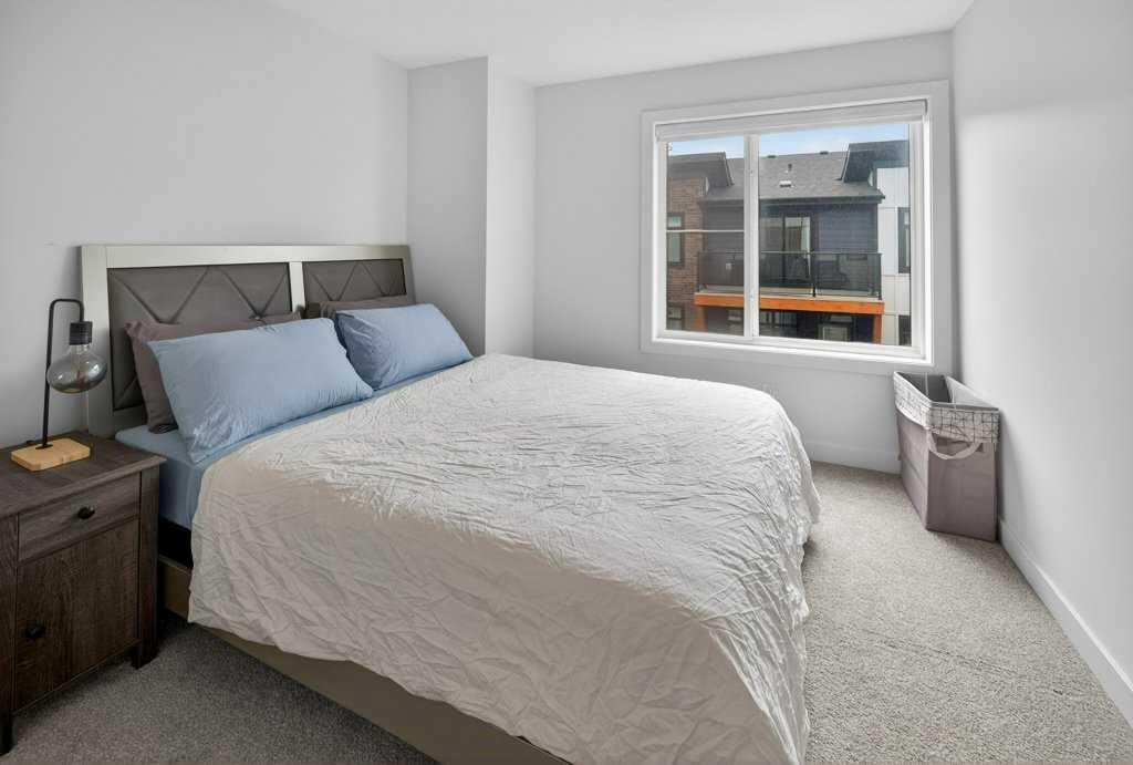 606-550 Seton Circle Se, Calgary, AB - Indoor Photo Showing Bedroom
