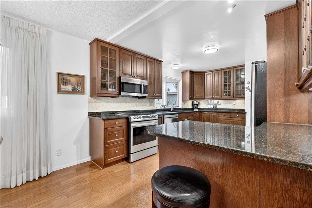 1707 107 Avenue Sw, Calgary, AB - Indoor Photo Showing Kitchen With Stainless Steel Kitchen
