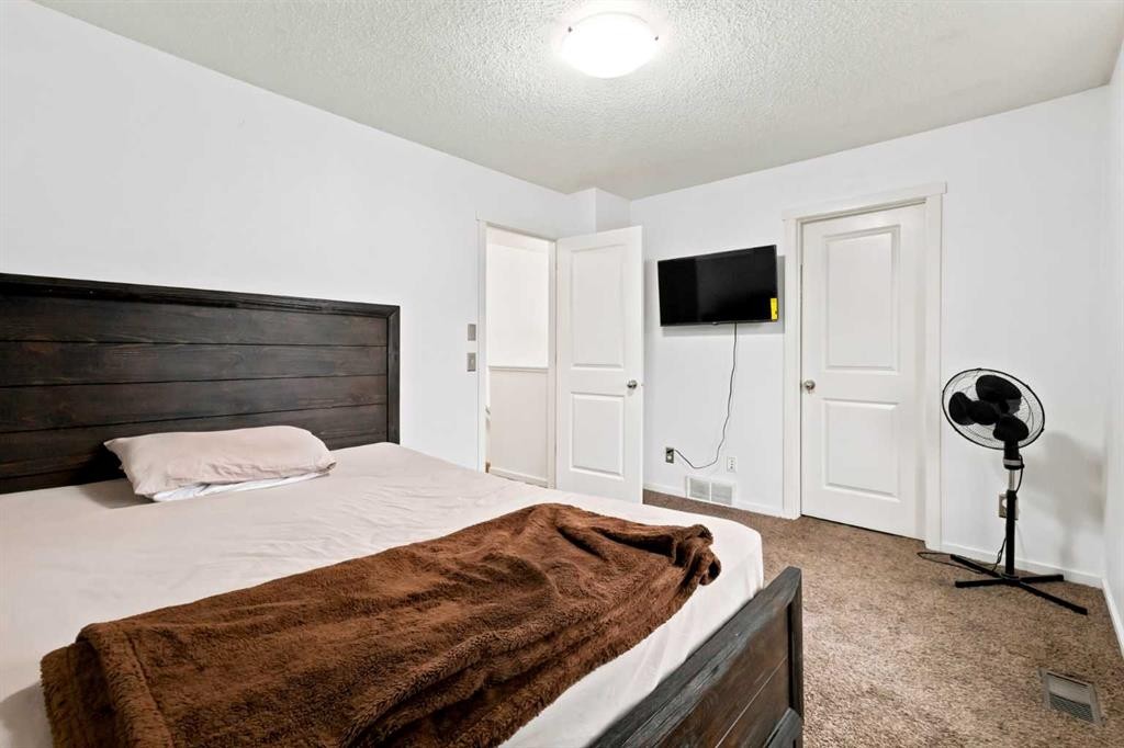 98 Panatella Hill Nw, Calgary, AB - Indoor Photo Showing Bedroom