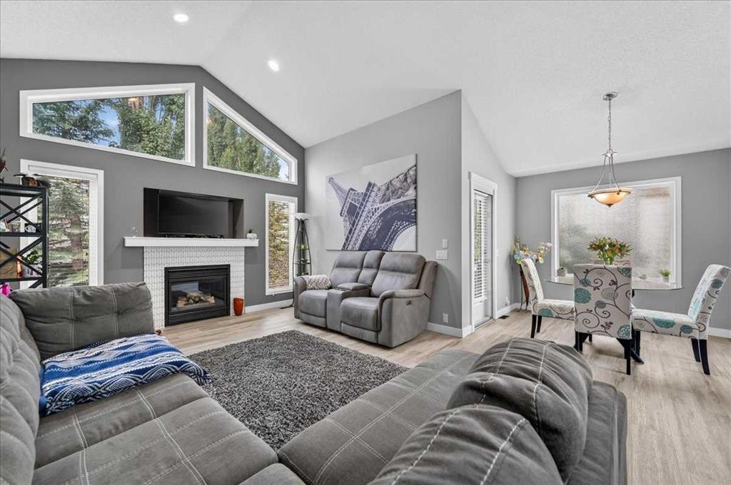 212 Cresthaven Place Sw, Calgary, AB - Indoor Photo Showing Living Room With Fireplace