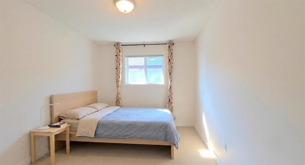 210 Panamount Hill Nw, Calgary, AB - Indoor Photo Showing Bedroom
