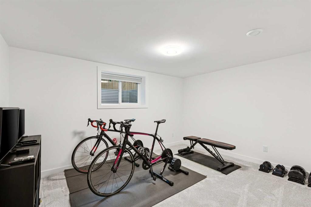14 Butte Place Nw, Calgary, AB - Indoor Photo Showing Gym Room