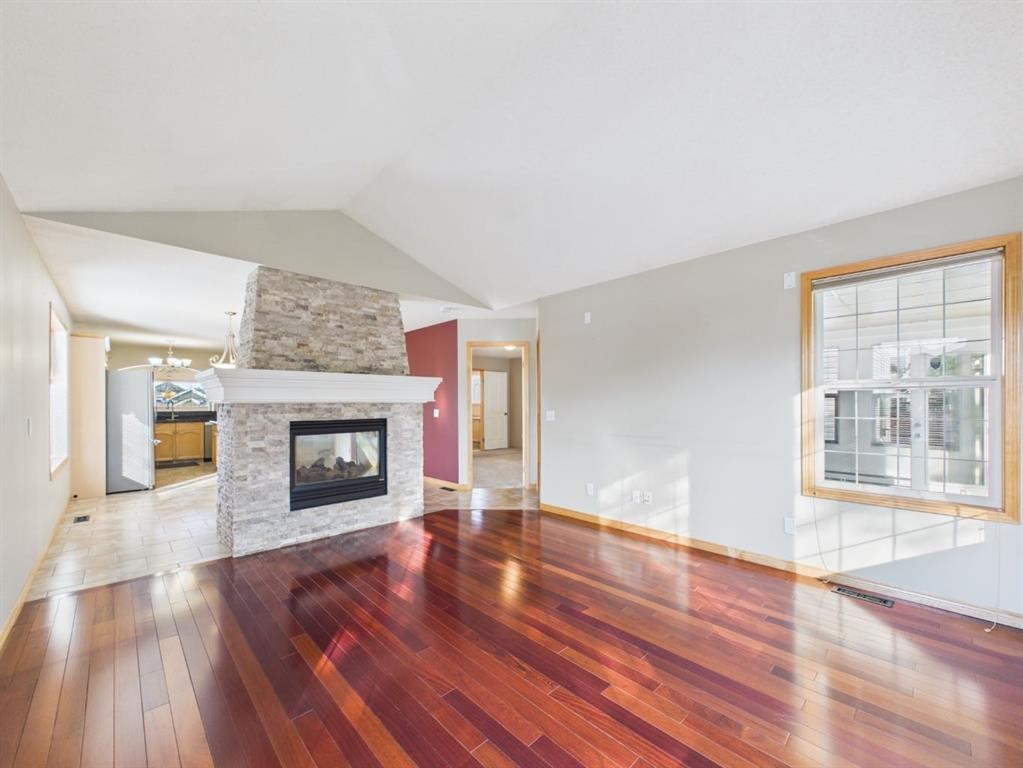 181 Panamount Hill Nw, Calgary, AB - Indoor Photo Showing Living Room With Fireplace