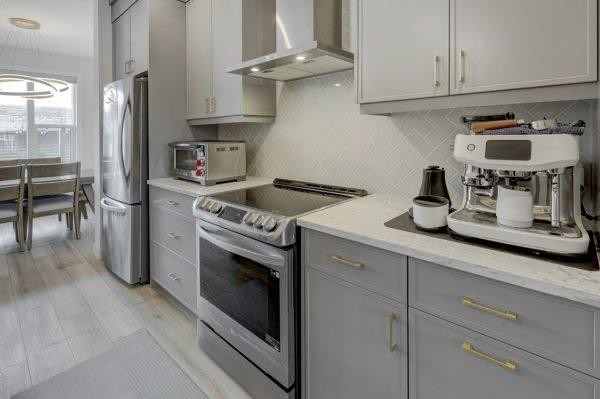 174 Rowley Gate Nw, Calgary, AB - Indoor Photo Showing Kitchen With Stainless Steel Kitchen