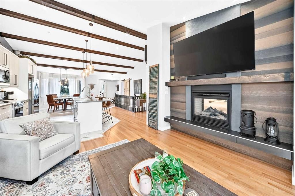 61 West Edge Road, Cochrane, AB - Indoor Photo Showing Living Room With Fireplace