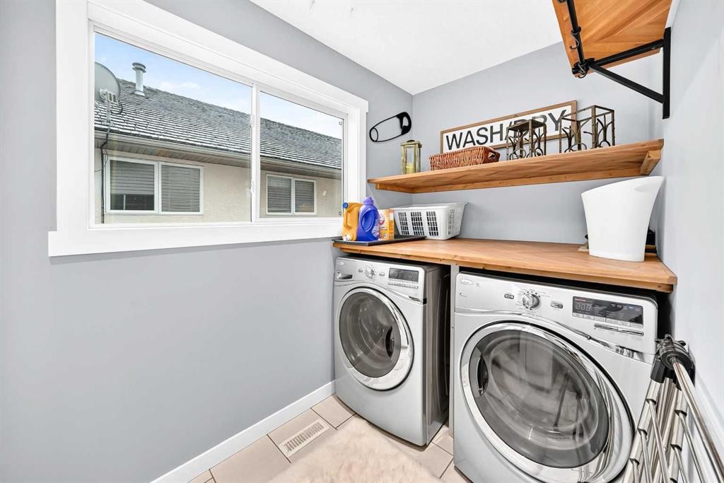 61 West Edge Road, Cochrane, AB - Indoor Photo Showing Laundry Room