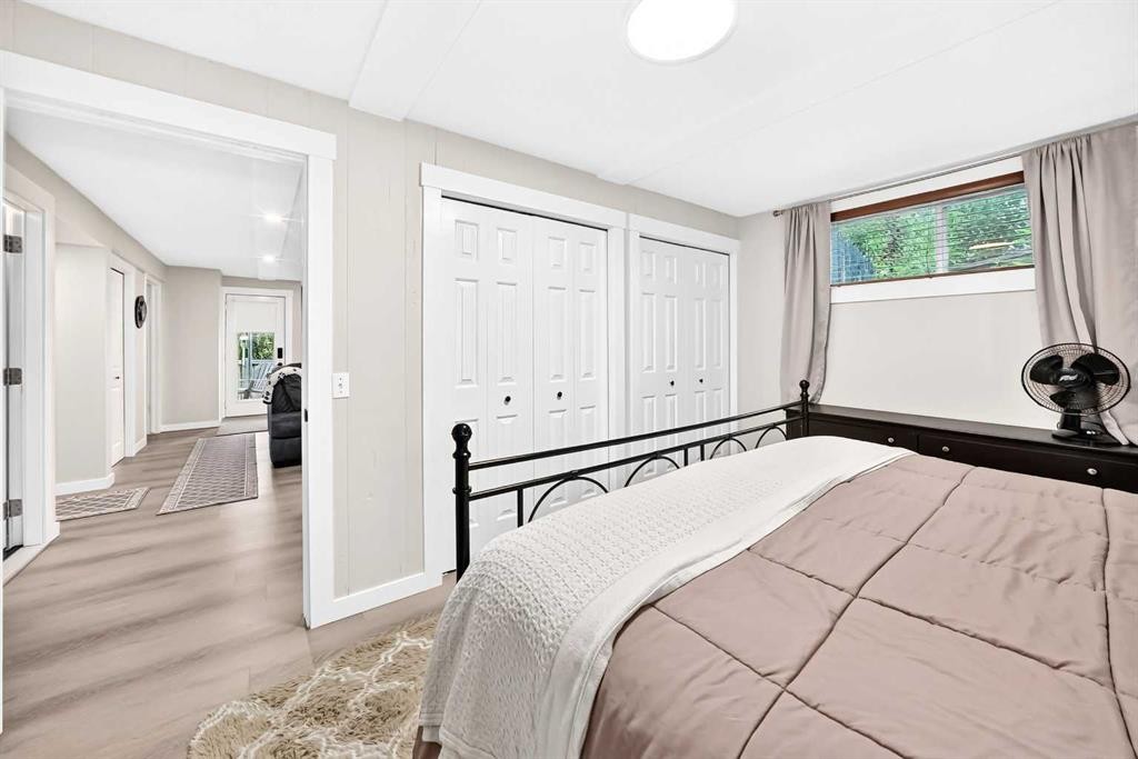 61 West Edge Road, Cochrane, AB - Indoor Photo Showing Bedroom