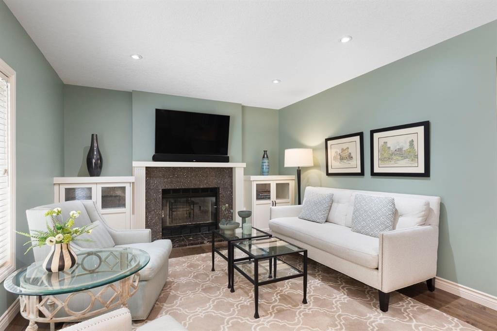 311 Woodhaven Bay Sw, Calgary, AB - Indoor Photo Showing Living Room With Fireplace
