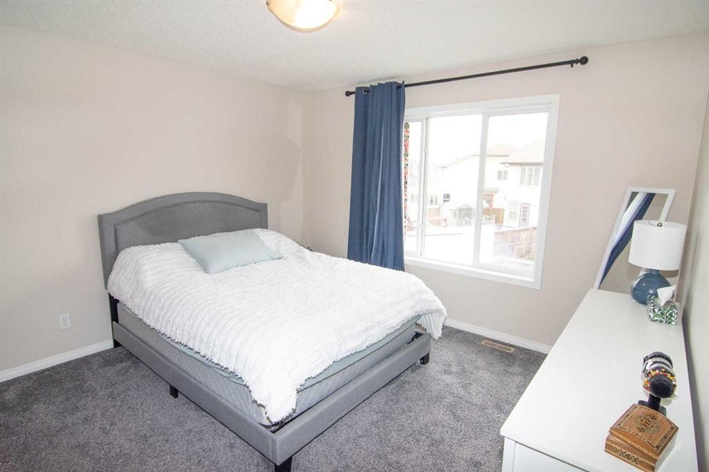 754 Luxstone Gate Sw, Airdrie, AB - Indoor Photo Showing Bedroom