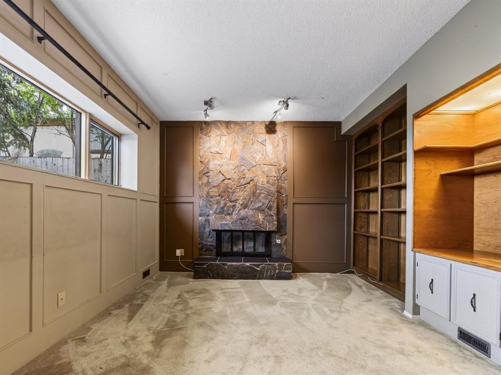 76 Deermoss Crescent Se, Calgary, AB - Indoor Photo Showing Other Room With Fireplace