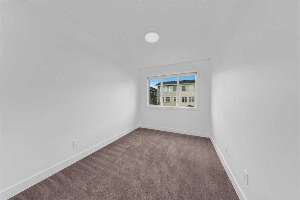 242 Carrington Gate Nw, Calgary, AB - Indoor Photo Showing Other Room