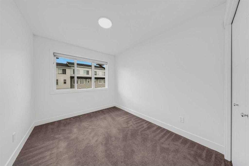 242 Carrington Gate Nw, Calgary, AB - Indoor Photo Showing Other Room