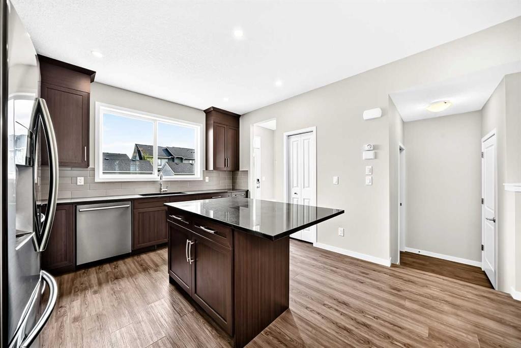 18 Willow Crescent, Okotoks, AB - Indoor Photo Showing Kitchen With Stainless Steel Kitchen