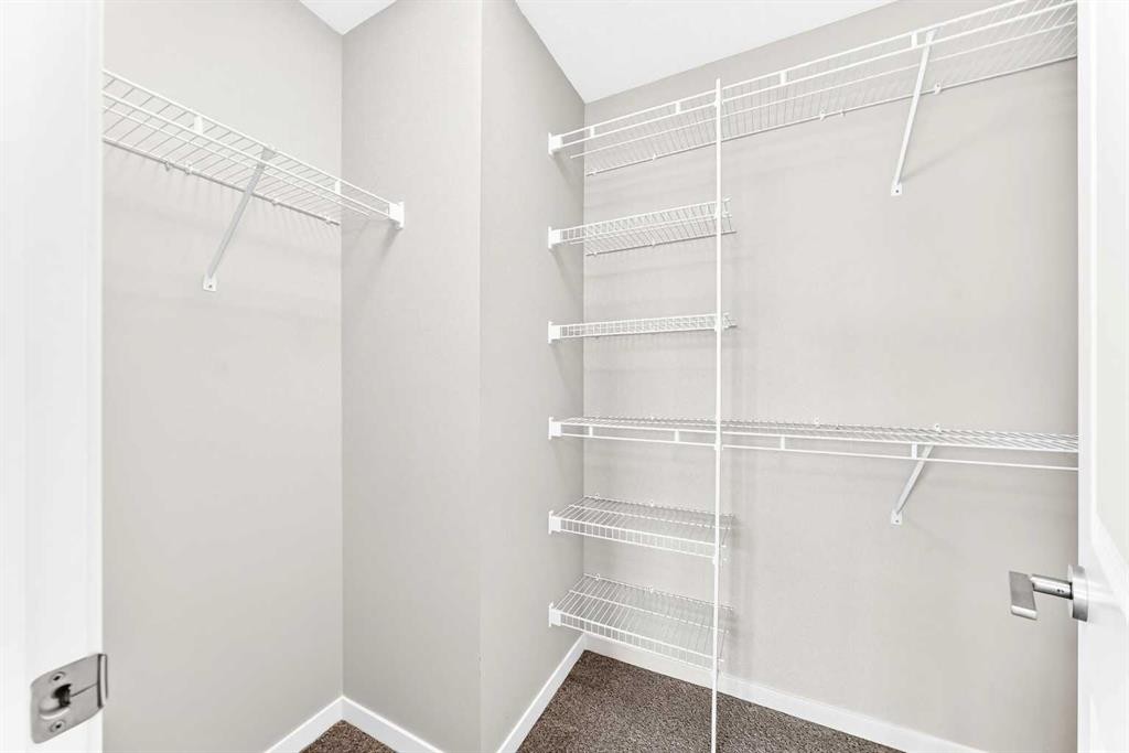 18 Willow Crescent, Okotoks, AB - Indoor With Storage