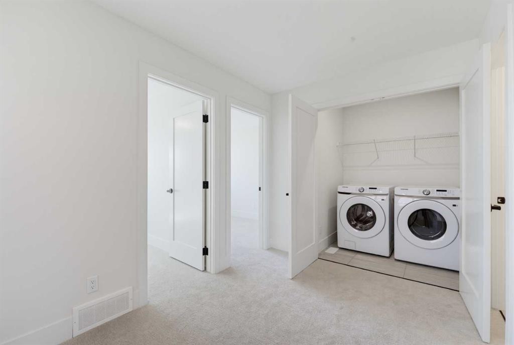 2465 Creeker Lane, Airdrie, AB - Indoor Photo Showing Laundry Room