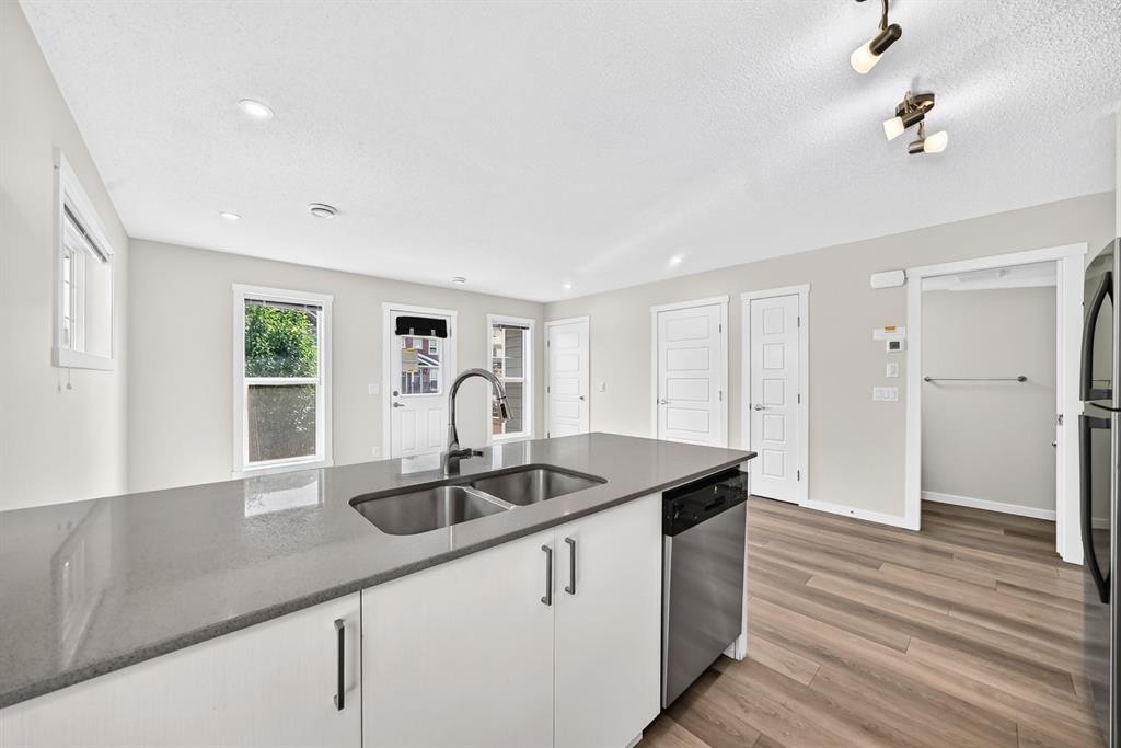 428 Cranbrook Square Se, Calgary, AB - Indoor Photo Showing Kitchen With Double Sink