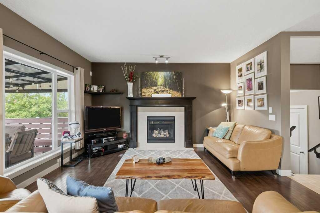 69 Everhollow Avenue Sw, Calgary, AB - Indoor Photo Showing Living Room With Fireplace