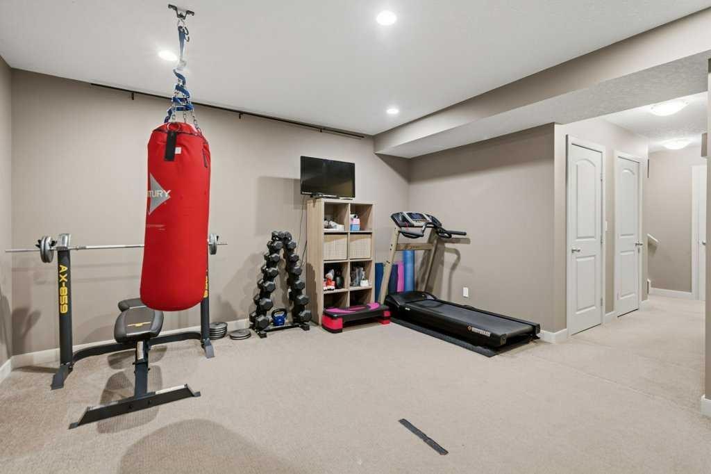 69 Everhollow Avenue Sw, Calgary, AB - Indoor Photo Showing Gym Room